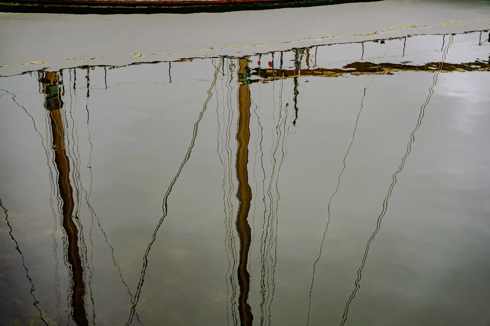 A close up of the side of a building with water dripping.