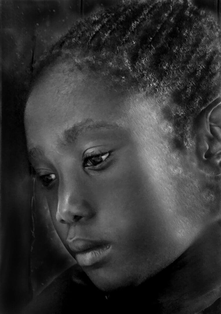 A black and white photo of a young girl.