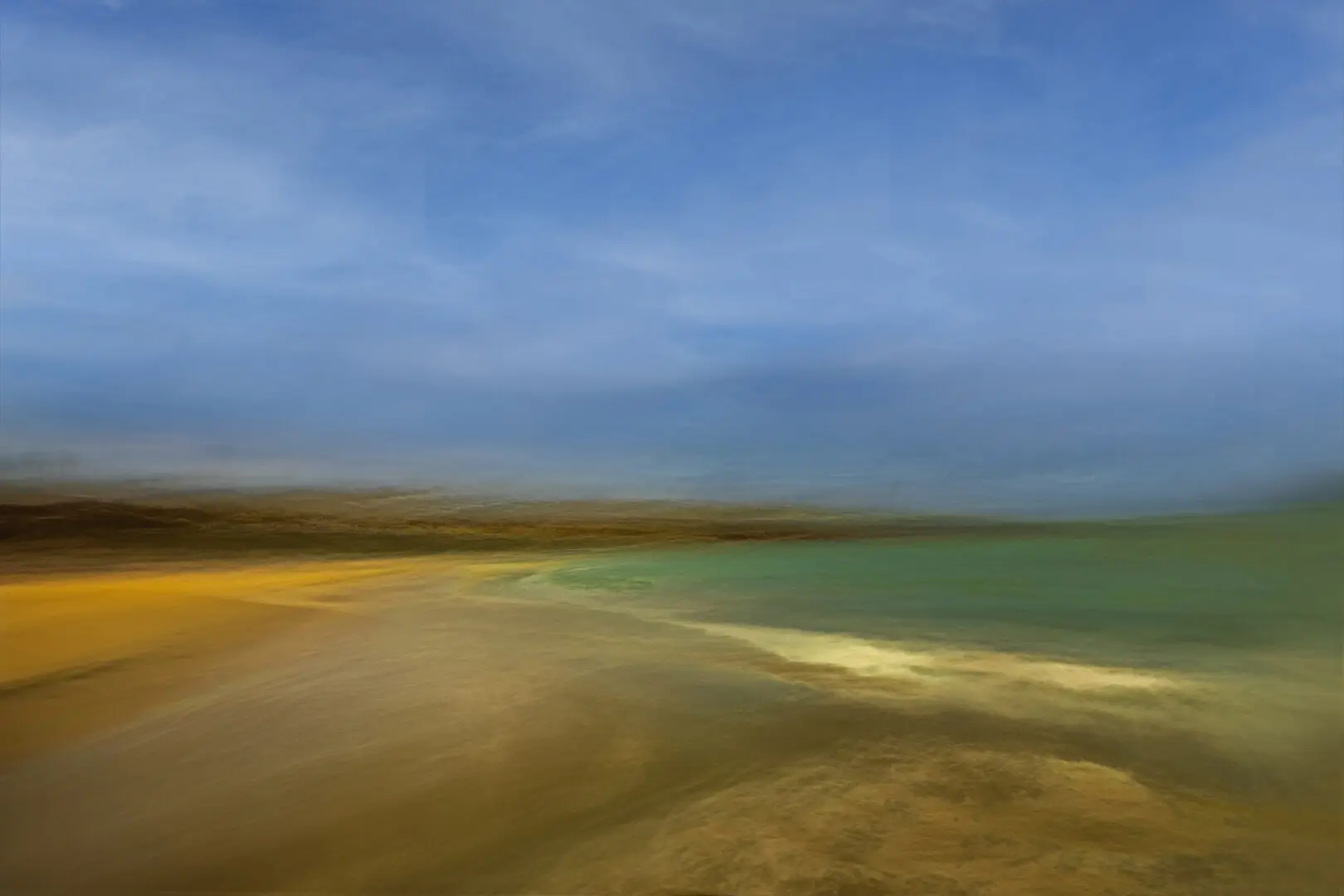 A beach with a blue sky and some water