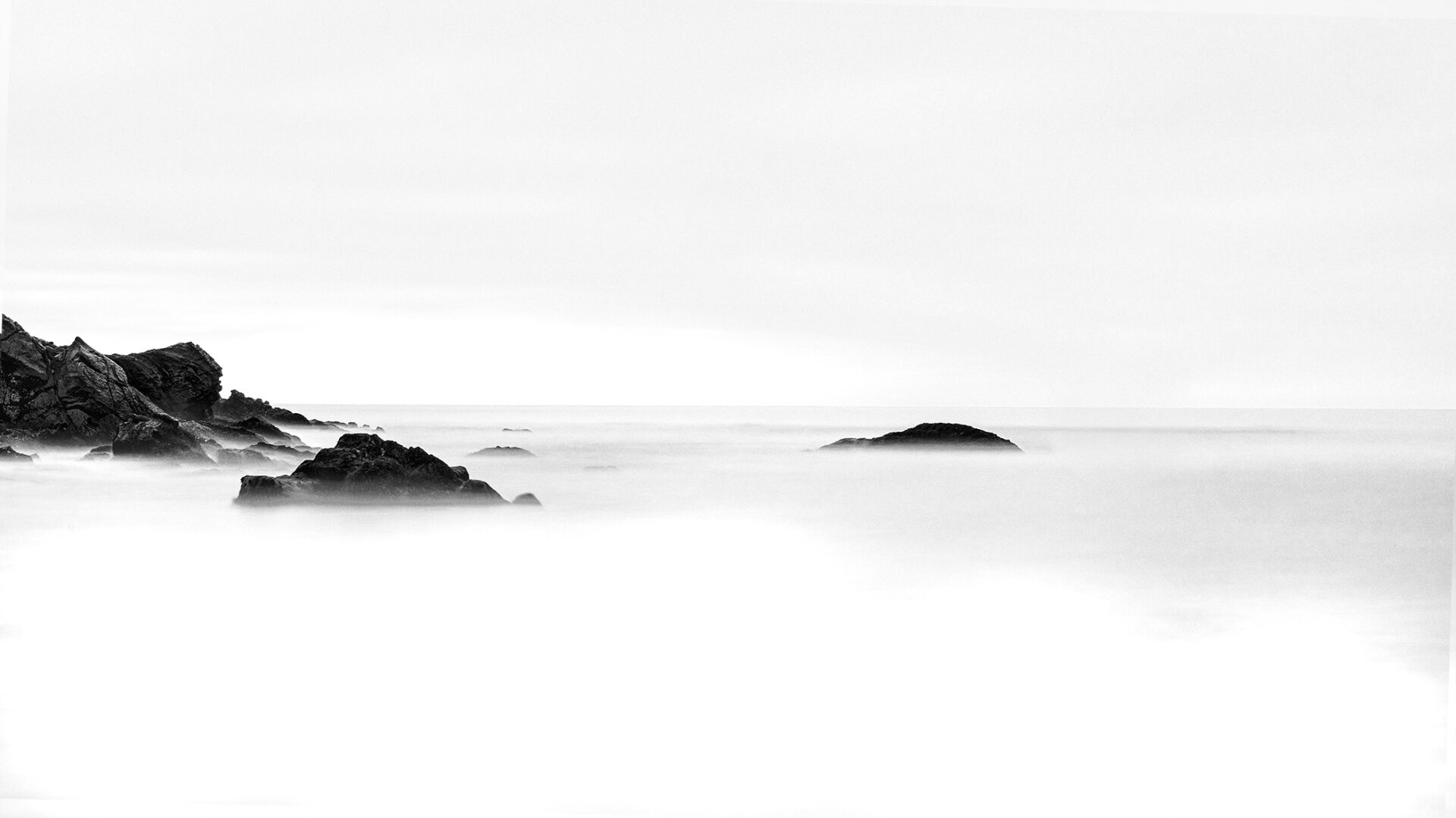 Minimal black and white rocky seascape